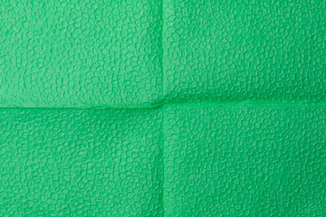 Fototapeta premium Background of an green napkin in the form of an open book