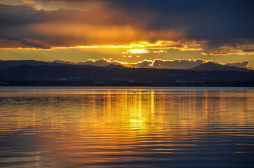 Sunset at pier in the Natural Park of the Albufera in Valencia