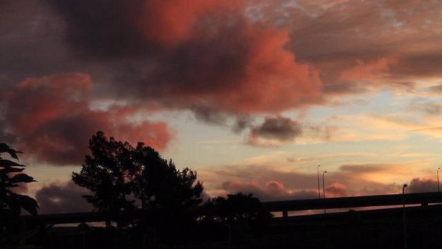 Time lapse clouds over freeway