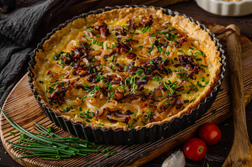 Homemade cheese quiche with onion and bacon