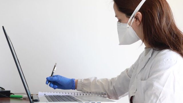 nurse with protective mask in medical office
