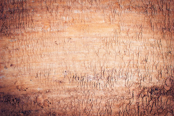 Smooth surface of dark dry sand, sand texture