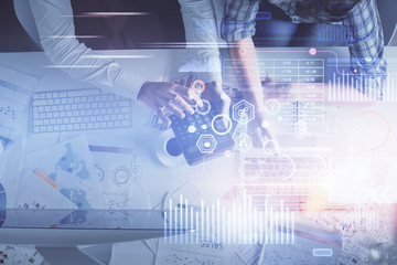 Double exposure of man and woman working together and data theme hologram drawing. Computer background. Top View.