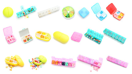Set of containers with pills on white background