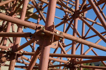 Scaffolding Elements Construction. Metal scaffolding tubes and bars. Construction site details. Bridge support. Industrial background.