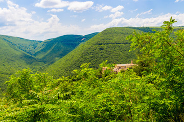 Picturesque distant springtime view of Convento di San Giacomo, Convent of San Giacomo in Cingoli,...