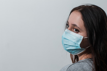 girl in a protective mask during an epidemic. protection against coronavirus. protective measures for coronavirus. black face mask