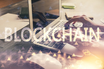 Double exposure of woman hands typing on computer and crypto market theme hologram drawing....