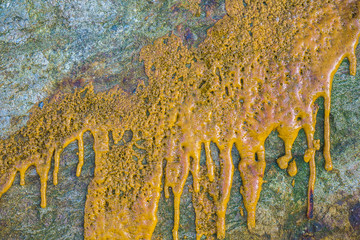 Paint or other liquid is splashed on the stone.