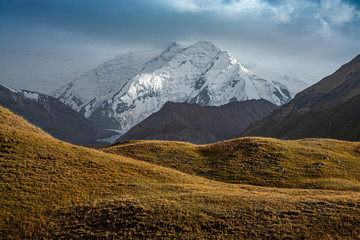 Fototapeta premium Scenic landscape of mountain in Kyrgyzstan. The Trans-Alay Range. Pamir Mountain System. Cloudy day.