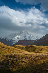 Scenic landscape of mountain in Kyrgyzstan. The Trans-Alay Range. Pamir Mountain System. Cloudy day.
