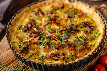 Homemade cheese quiche with onion and bacon