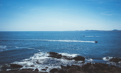 
ocean water coast rocks beach sky