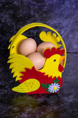 Close-up image of organic chicken eggs on a dark wooden table.Easter concept