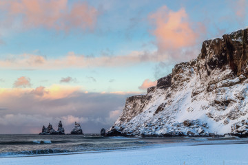 Iceland winter, trolls fingers rock, Vik village, sunset in Iceland