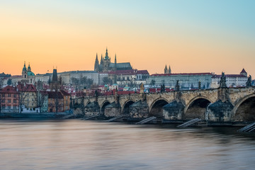 Obraz premium Charles bridge and the Prague castle panorama during the golden hour, Prague, Czech Republic