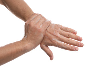 Man washing hands with soap on white background, closeup