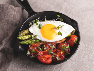fried egg on toast with roasted tomato asparagus breakfast, healthy food