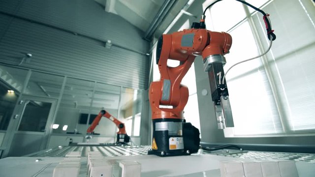Mechanized robots are transporting tiny cubes