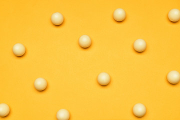 Tasty chocolate candies on color background