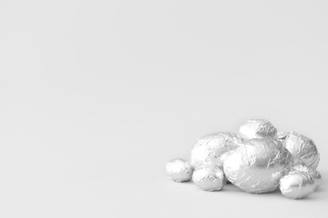 Sweet chocolate eggs on light background