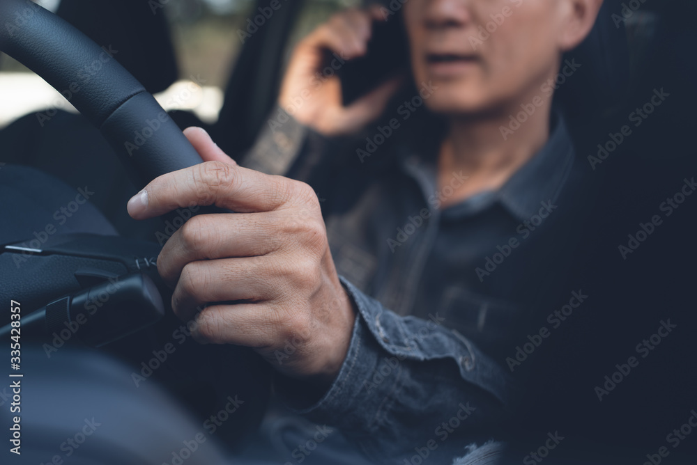 Wall mural Using smartphone while driving a car