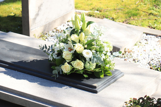Funeral flowers on a tomb