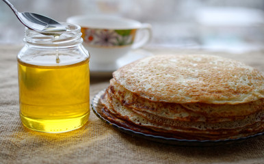 morning breakfast with pancakes and honey.