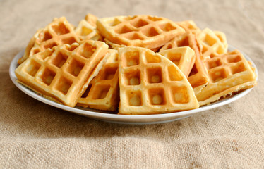 freshly baked waffles on a plate.