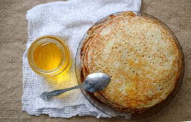 morning breakfast with pancakes and honey.