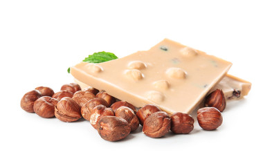 Sweet chocolate with nuts on white background
