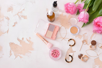 Obraz na płótnie Canvas Makeup cosmetics with jewelry on white background