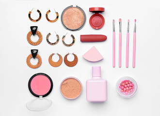 Fototapeta na wymiar Makeup cosmetics with accessories on white background