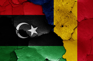 flags of Libya and Chad painted on cracked wall