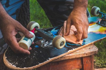 man restoring an old skate