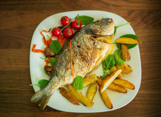 Dorada fish dish with rosemary potatoes