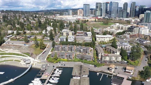 Aerial / drone footage of Meydenbauer Bay Park, beach park, marinas with waterfront mansions in Belleview, Washington near Seattle, during the COVID-19 pandemic lockdown