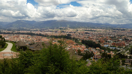Fototapeta na wymiar View of the colonial city from the viewpoint on a partially sunny day.