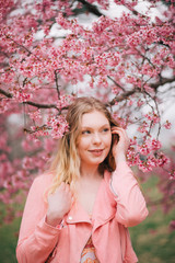 Girl in a cherry blossom garden