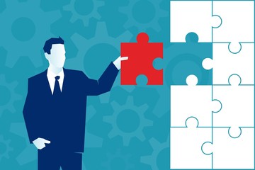  Businessman places the last piece of a puzzle