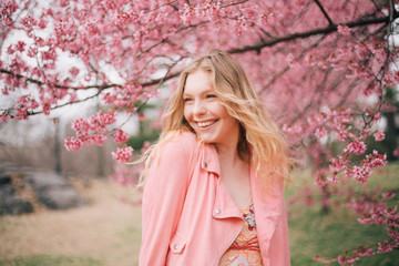 Girl in a cherry blossom garden