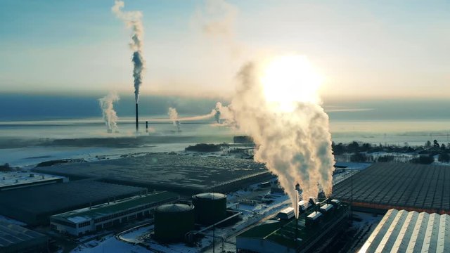 Power plant emissions into air. Smoke stack, pollution concept.