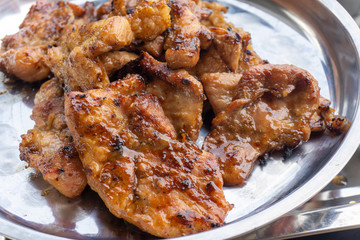 Thai grilled pork neck marinated in the hot sauce from the grill