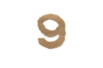 Arabic number symbol isolated over white background. English flat brown torn paper number 9