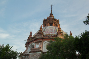 colorful dome of mexican church, baroque style with arabic mix