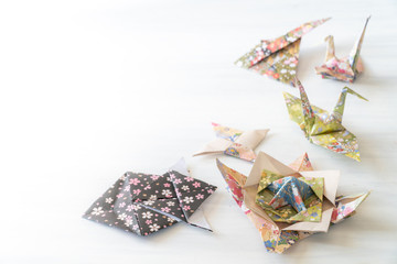 Origami folded shapes on Table with Copy Space