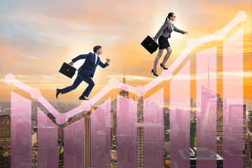 Business people climbing bar charts in growth concept