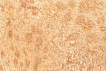 Texture of thin traditional freshly baked homemade italian bread. Close-up pita bread as a textured bread background.