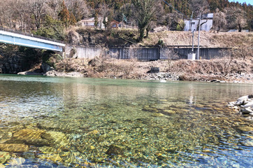 Fototapeta na wymiar bridge over river in winter