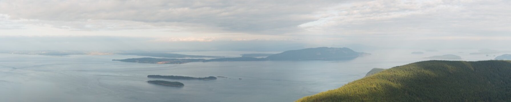 panoramic aerial view of sea and islands with cloudy sky in Washington